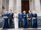 bridesmaids wearign super elegant midnight blue maxi dresses with high necklines and long sleeves