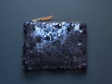 a large sequin midnight blue purse for carrying all your necessary things for the big day