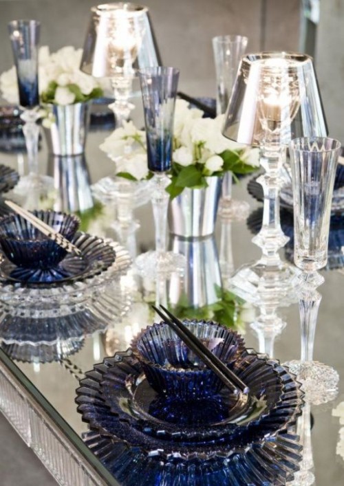 midnight blue plates and chargers and glasses add color to the space with a gentle feel