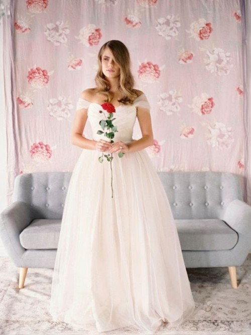 off the shoulder wedding princess style wedding dress with draped bodice and a layered skirt is a beautiful solution for a romantic bride