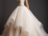 a fab princess style wedding dress with a sleeveless embellished bodice and a full layered skirt with a train is amazing for a refined modern wedding with a touch of fairy-tale
