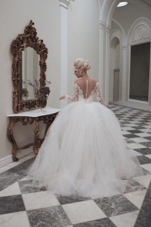 a princess style wedding ballgown with a lace bodice with long sleeves, an illusion back and a layered full skirt is a fab statement at a refined wedding