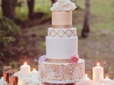 a romantic wedding cake with blush and white plain tiers, with a blush ruffle floral one and fresh roses on top