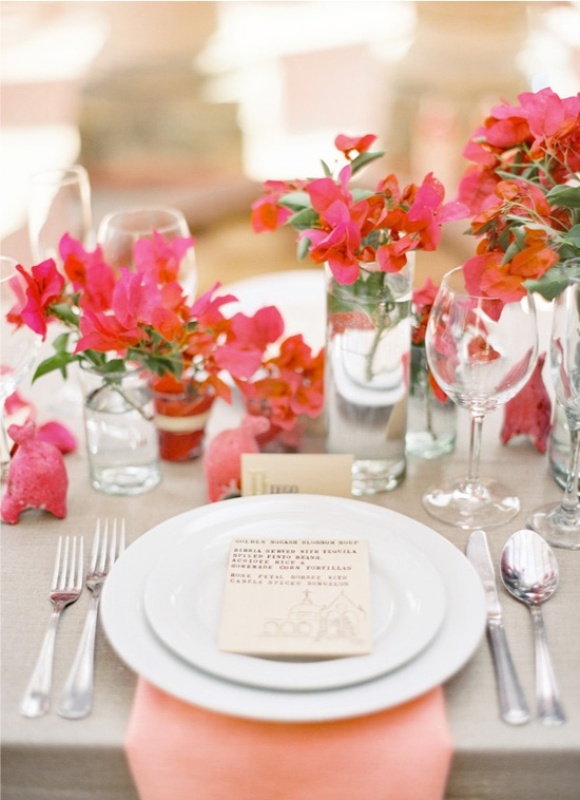 Fuchsia, hot pink florals and coral napkins for a bold and creative look of the wedding tablescape