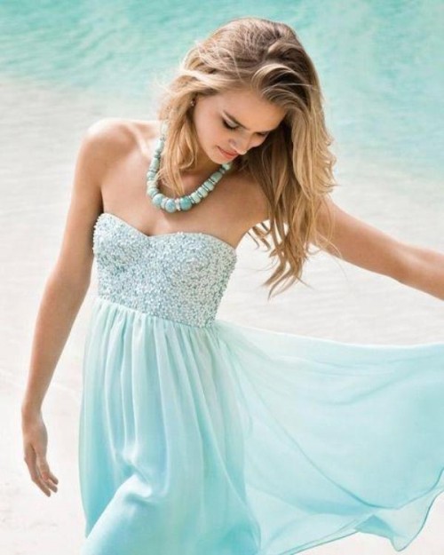 a strapless mint blue knee bridesmaid dress with an embellished bodice and a statement necklace to finish the look off