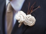 a creative wedding boutonniere of branches and fabric flowers is a very chic and eye-catchy idea to try