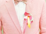 a colorful fabric boutonniere of pieces of fabric and ribbons is a fun idea that adds a playful touch to the outfit