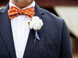 a fluffy pompom wedding boutonniere with a striped ribbon is a lovely and fun idea with a touch of softness