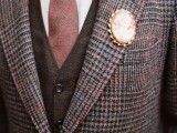 a vintage brooch instead of a boutonniere looks elegant and sticks to the vintage-inspired style of the groom