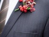 a sumptuous boutonniere of berris, bold blooms and foliage is a cool and bold idea for a fall groom