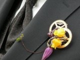 a steampunk wedding boutonniere of gears and bold blooms plus a twig is a very chic and statement-like idea for a steampunk wedding