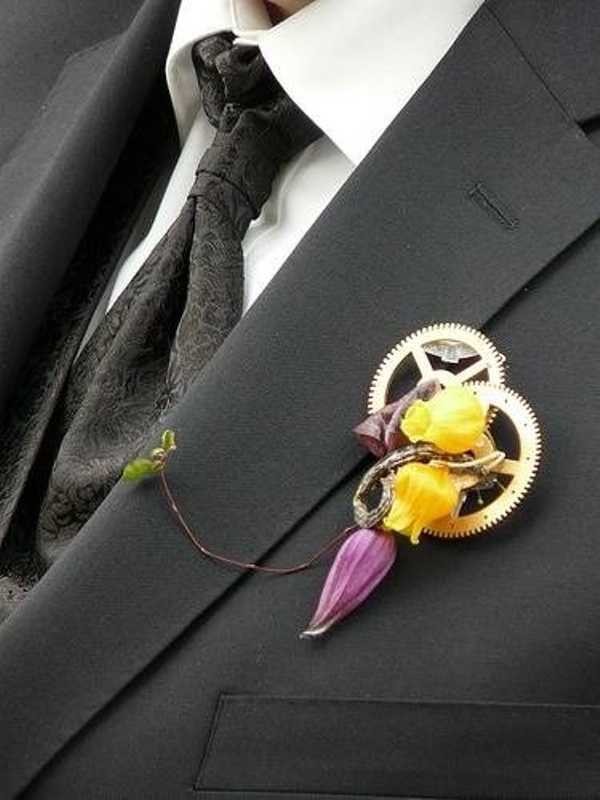 a steampunk wedding boutonniere of gears and bold blooms plus a twig is a very chic and statement like idea for a steampunk wedding