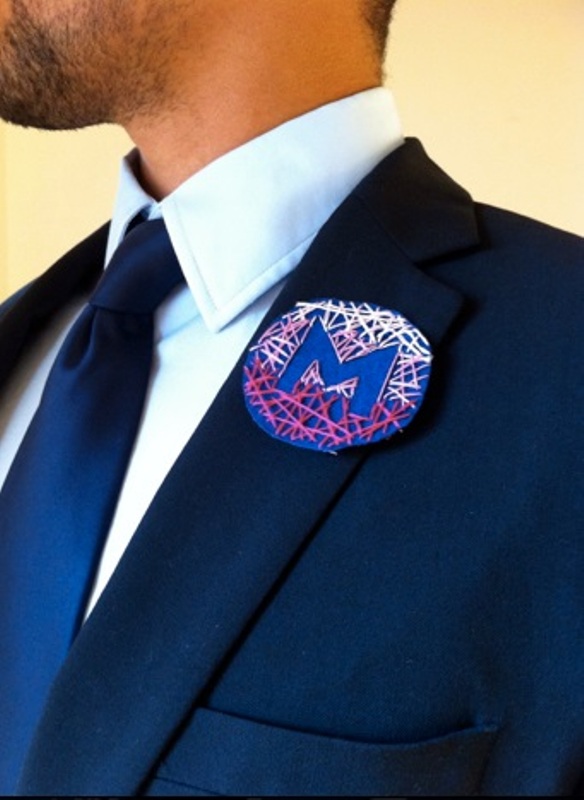 a very creative ombre embroidered wedding badge with a monogram is a unique alternative to a usual wedding boutonniere