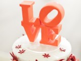 orange sugar LOVE letters stacked are a great cake topper for any bright and modern wedding cake