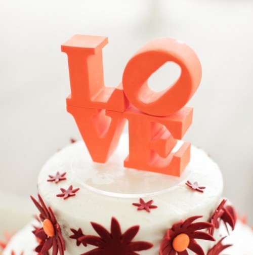 orange sugar LOVE letters stacked are a great cake topper for any bright and modern wedding cake