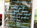 a window with a wedding menu is a simple and cool idea for a vintage or rustic wedding