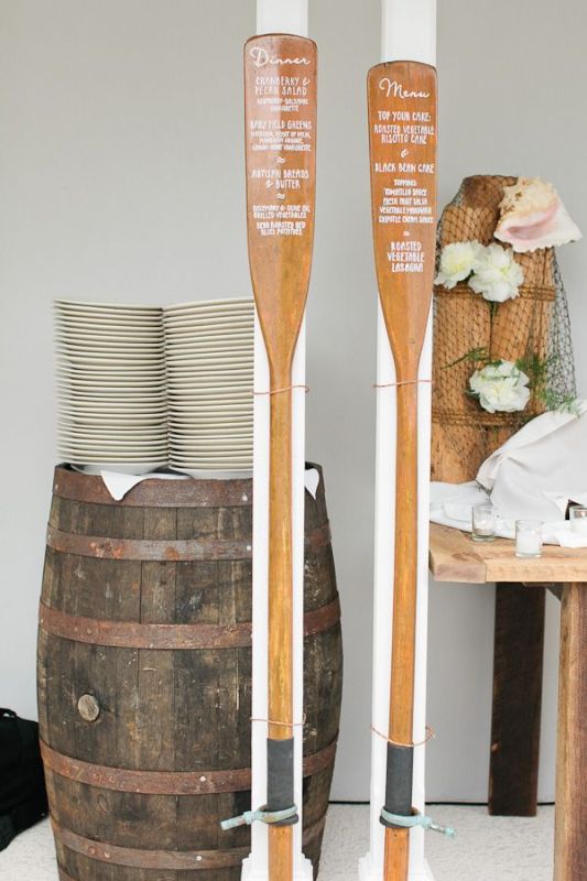 Wooden oars with menus are very cool for fun and can be used for a river or lake wedding