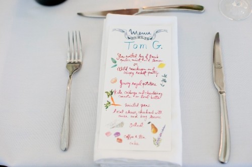 a colorful wedding menu with food painted right on it for a fun and playful modern wedding