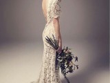 a simple and chic lace sheath wedding dress with short sleeves, a low back and a small train for a summer boho bride