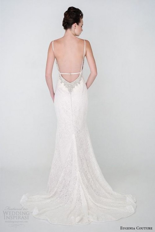 a lace mermaid wedding dress with a low back with thin straps, embellishments and a train is very chic and beautiful