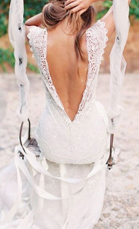 a boho lace A-line wedding dress with thick straps and a low back for a summer boho bride is very trendy