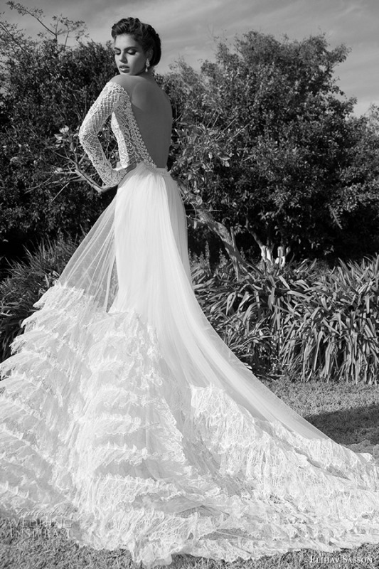 A bold A line wedding dress with a lace embellished bodice and a layered tulle skirt with ruffles for a refined bridal look
