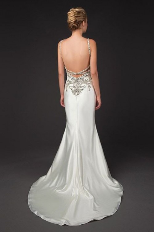a fabulous shiny mermaid wedding dress with embellishments and embroidery, embellished spaghetti straps and a train