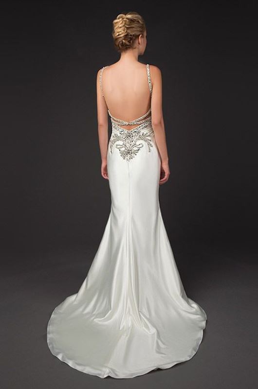 A fabulous shiny mermaid wedding dress with embellishments and embroidery, embellished spaghetti straps and a train