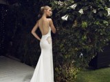 a chic plaid mermaid wedding dress with a low back, lace inserts, a train and spaghetti straps is gorgeous