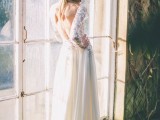 a fabulous A-line wedding dress with an embellished and floral applique bodice and a plain flowy skirt plus a low back and long sleeves