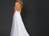 an A-line wedding dress – a lace plus plain one, with a low back, spaghetti straps and a train for a flowy boho bridal look