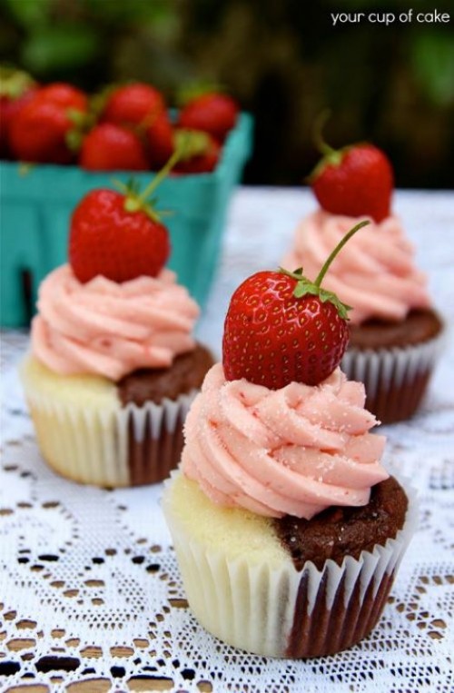 vanilla and chocolate cupcakes with pink icing and strawberries on top are delicious and fantastic