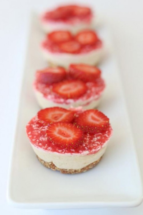 mini tarts with fresh strawberry suace and berry slices on top are amazing for a summer or fall wedding