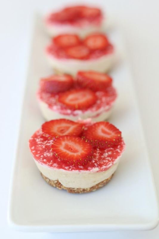 Mini tarts with fresh strawberry suace and berry slices on top are amazing for a summer or fall wedding