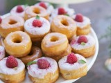 glazed donuts topped with raspberries are delicious and very tasty, they will fit a spring or summer wedding