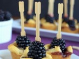 mini pastry cups with berry compote inside and blackberries on top are amazing for a fall wedding