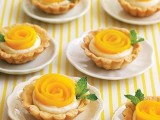 mini tarts with cream and peach sliced to form a flower are gorgeous for a summer wedding