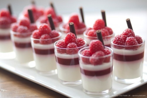 berry panna cotta with fresh raspberries and chocolate sticks is gorgeous for a summer or fall wedding