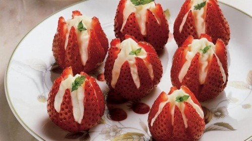 fresh strawberries filled with whipped cream are delicious and easy desserts for a spring or summer wedding
