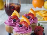 cupcakes with blueberry icing, fresh blueberries, strawberries and citrus slices are amazing for summer