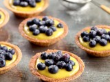 mini cups with custard and blueberries on top are a delicious wedding dessert for a summer or fall wedding
