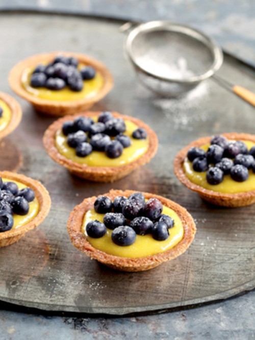 mini cups with custard and blueberries on top are a delicious wedding dessert for a summer or fall wedding