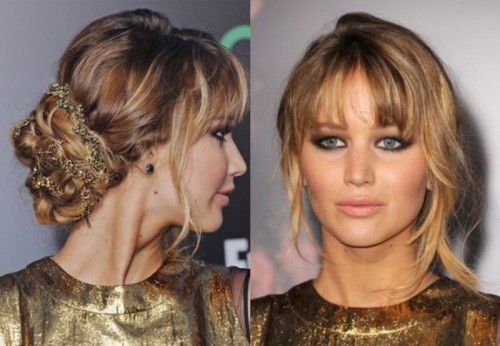 a wavy low chignon with a sparkling tie, a bump and wavy bangs is a trendy and messy idea