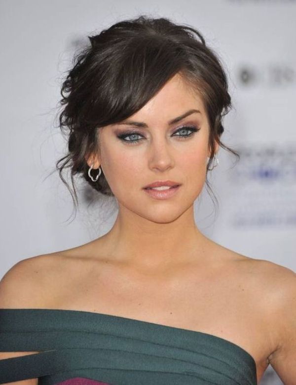 A wavy updo with side bangs is a chic and elegant idea that works for medium and long hair