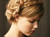 an updo with a double braid on top plus side bangs is a stylish idea with a rustic feel