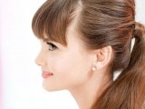 a ponytail with a bump and bangs is a cool idea for cuasl brides who don’t want much fuss with their hair