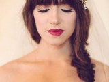 a relaxed fishtail braid with full fringe bangs and a sparkling headpiece for a modern and very sexy look