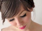a top knot with a braid and full fringe bangs is great to pull off bold and sexy bridal style with a touch of retro
