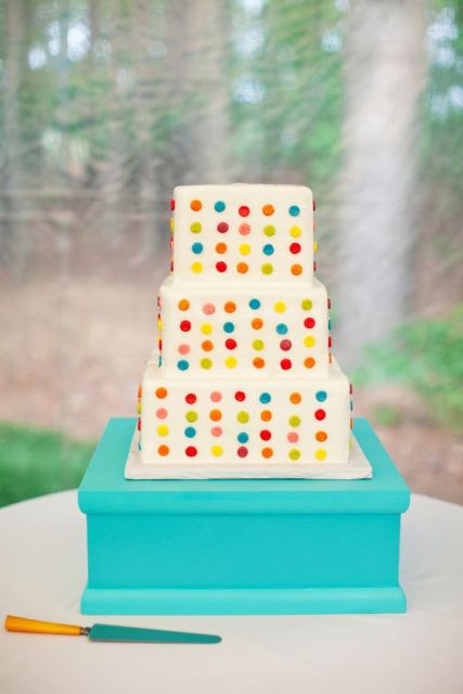 a white square wedding cake decorated with colorful polka dots is a fantastic idea for a colorful wedding in any season