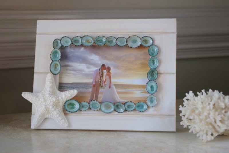 Your photo in a beach frame decorated with starfish and little blue shells plus corals